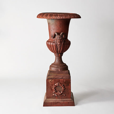 Urn with Faun on Back Plinth
